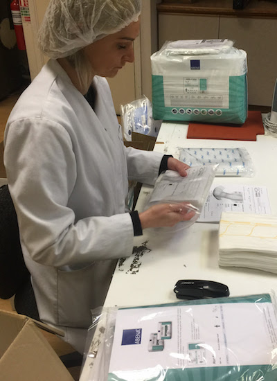 Kamila packing nappy samples in the Every Nappy clean room